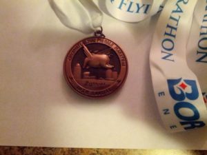 Medal back.  Gotta love that you see the backside of the pig.